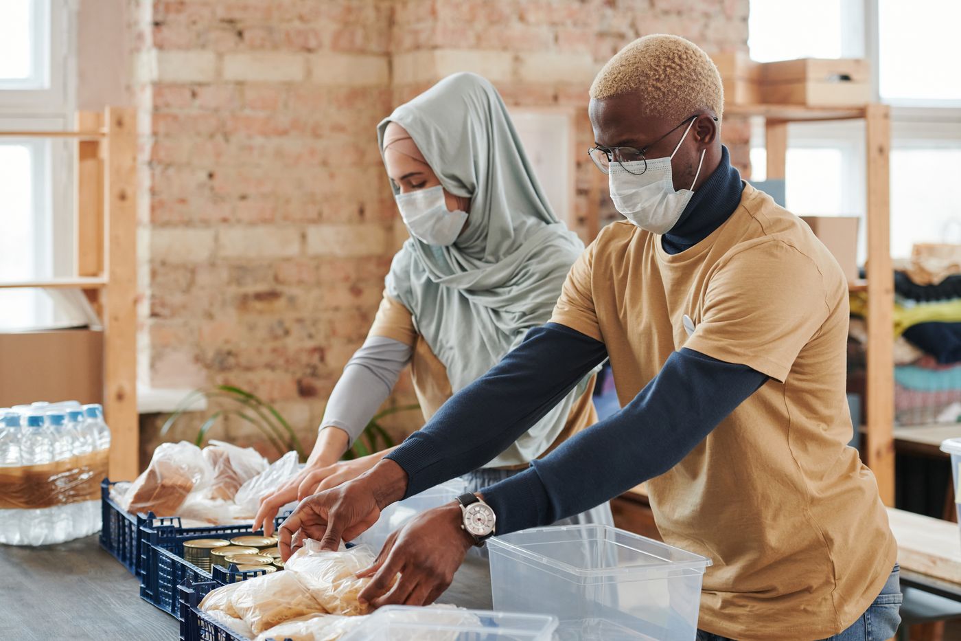 Community volunteers organize donated food and everyday essentials.
